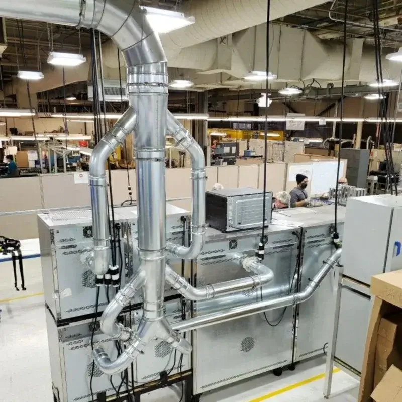 Installed US Duct branches and manifold above production equipment